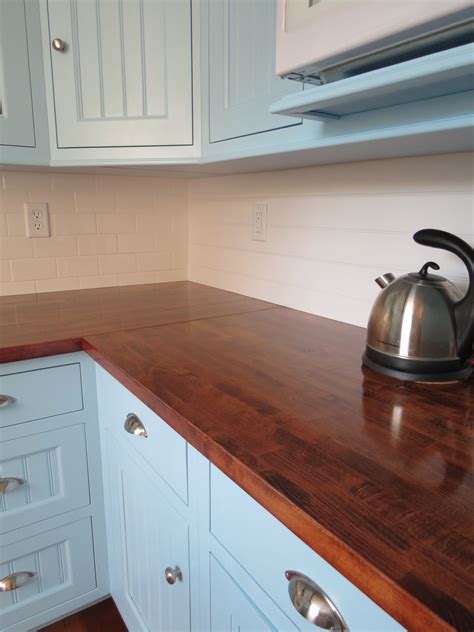 Countertops with a top layer of wood have all the qualities of solid wood, enhanced by modern technology. Butcher block countertops from Ikea, sanded down, stained ...