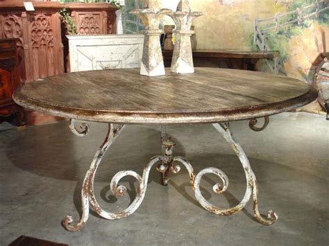 These wrought iron, wood, and glass tables are crafted here in the hills of arkansas. Round Oak Dining Table from France with Antique Iron Base ...