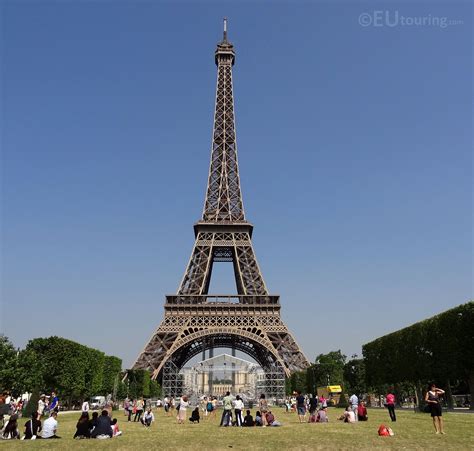 The Champ De Mars Park On One Side Of The Eiffel Tower Has