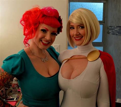 Two Women Dressed In Costumes Posing For The Camera