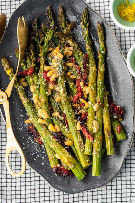 Spread the asparagus in a single layer on a baking sheet and drizzle lightly with olive oil. Oven Roasted Asparagus with Sun Dried Tomatoes (VIDEO!!)
