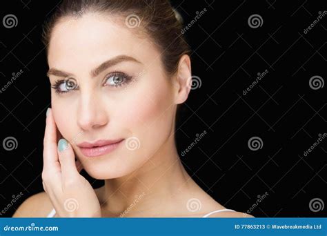 Portrait Of Beautiful Woman Posing Against Black Background Stock Image