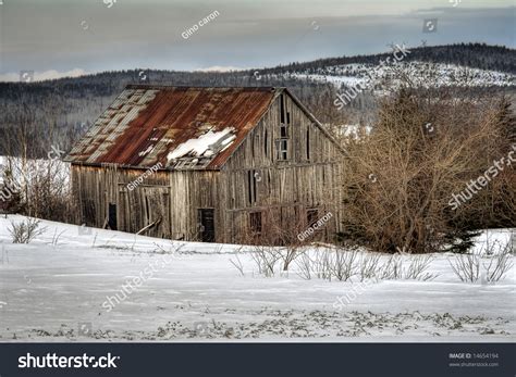 An Old Abandoned Barn In A Field At Winter Stock Photo 14654194