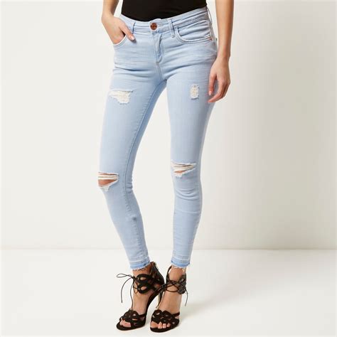 River Island Light Wash Ripped Amelie Super Skinny Jeans In Blue Lyst