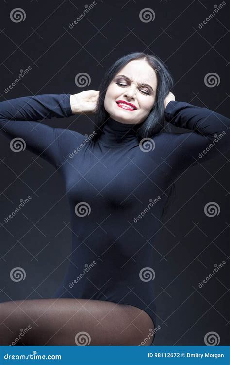 Portrait Of Screaming Caucasian Mature Brunette Posing In Black Body