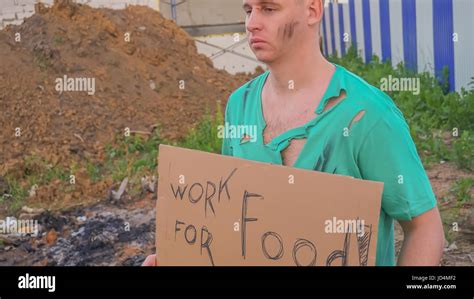 Homeless With A Sign In Hand Work For Food Stock Photo Alamy