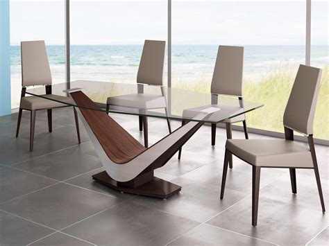 This set features a round dining table and four dining chairs. Elite Victor Dining Table | Modern glass dining table, Round dining room, Modern dining table