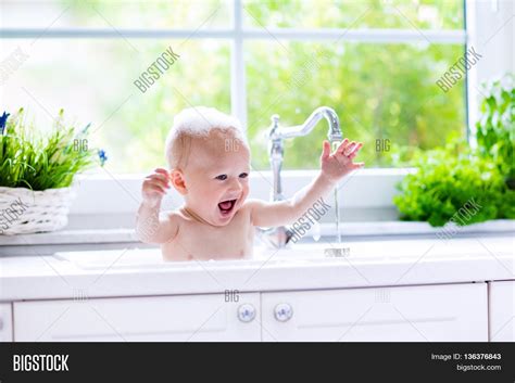 A wide variety of you can also choose from more than 5 years, none, and 5 years baby bath tub sink, as well as from kitchen, hotel, and apartment baby bath tub. Baby Taking Bath Kitchen Sink. Image & Photo | Bigstock