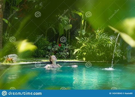 Sensual Young Woman Relaxing In Outdoor Spa Infinity