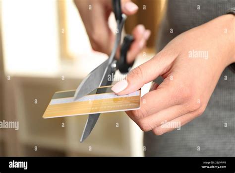 Female Hands Cutting Credit Card With Scissors Stock Photo Alamy