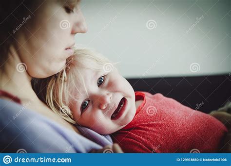 Mother Comforting Crying Little Baby Care And Support Stock Photo