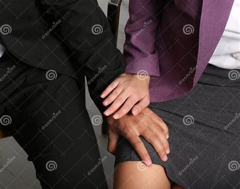 Boss Molesting His Female Secretary In Office Closeup Stock Image