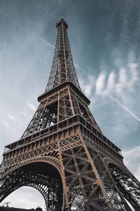 Low Angle Shot Of Eiffel Tower Under Blue Sky · Free Stock Photo