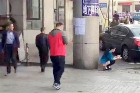 Sickening Video Shows Woman Pooing In Street Outside Train Station As
