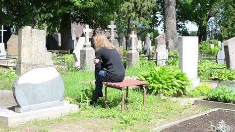 Grieving Woman Kneeling At A Grave Stock Footage Video
