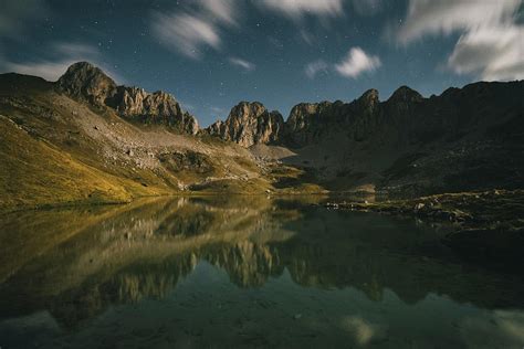 Mountain Reflection In A Lake At Night Against Starry Sky Pyrenees