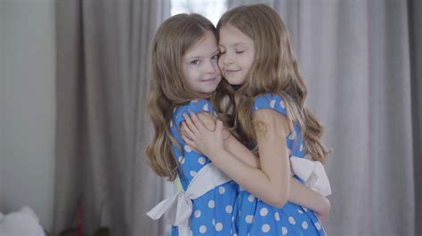 portrait of two joyful twin sisters stock footage sbv 338137316 storyblocks