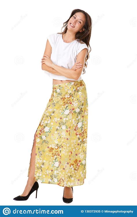 Full Body Happy Young Asian Woman Posing With Arms Crossed Against