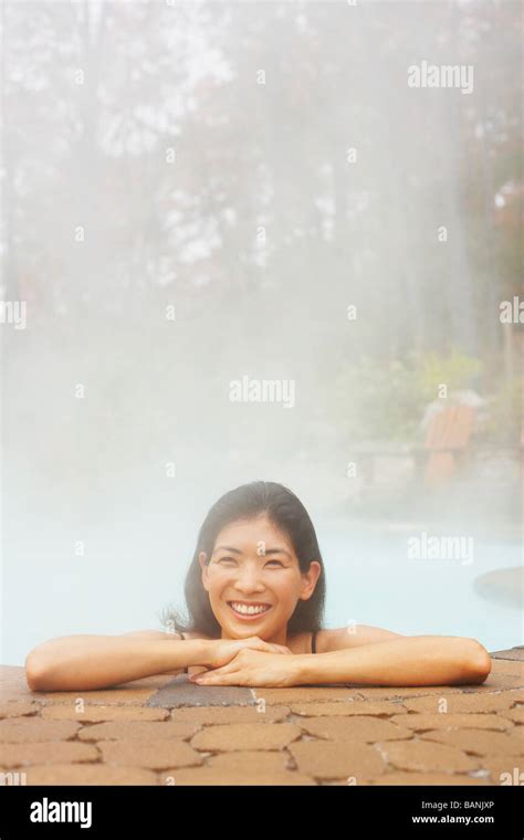 Asian Woman Sitting In Hot Tub Stock Photo Alamy