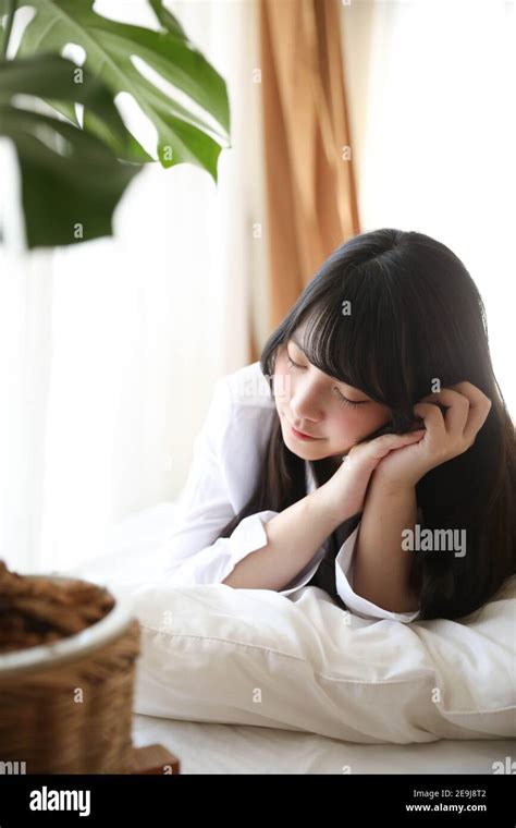 Portrait Beautiful Asian Girl Sleeping On Bed In White Room Stock Photo