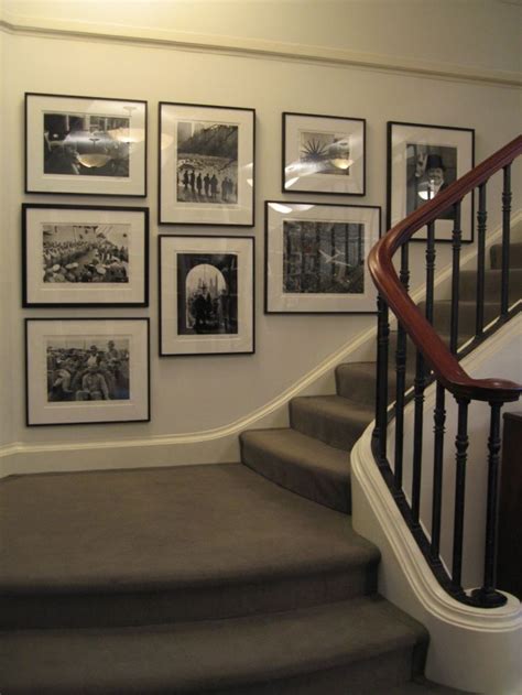 Create a gallery wall in a stairwell hgtv. I like this stairway gallery wall.. black and white ...