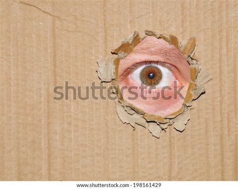 Eye Watching Through Hole Cardboard Box Stock Photo 198161429