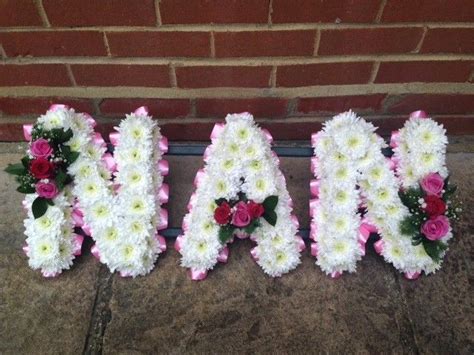 Although white funeral flowers are most commonly associated with loss, colorful flowers may be helpful in brightening up the atmosphere. nan tribute | Flower arrangements, Funeral flowers ...