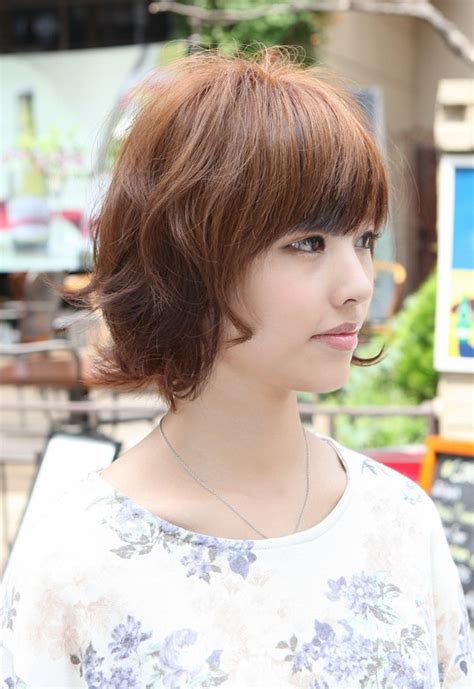 Modern short hairstyles finish of an edgy haircut with feminine softness. Asian Hairstyles: Soft & Casual Wavy Brown Bob Haircut ...