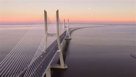 Vasco da gama is famous for his discovery of a maritime route between portugal and india. Vasco Da Gama Bridge Over Stock Footage Video (100% ...