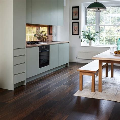 Various dark wood kitchen floors suppliers and sellers understand that different people's needs and preferences about their kitchens vary. Junckers dark wood floor with pale green kitchen | Wood flooring | housetohome.co.uk
