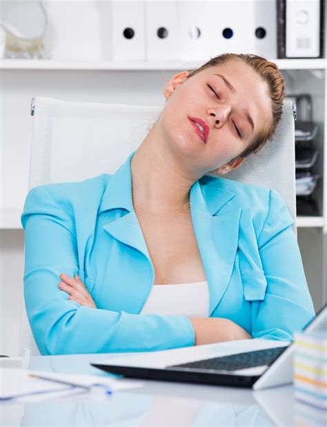 Woman Worker Is Sleeping At Work After Putting The Reports Stock Image