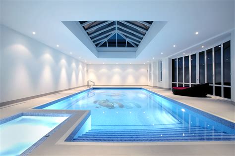 Indoor Pool With Skylight And Attached Spa