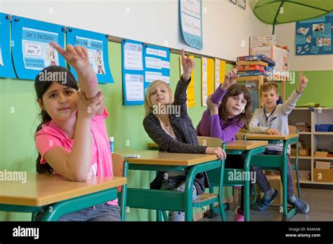 Boy Raising Hand In Classroom Hi Res Stock Photography And Images Alamy