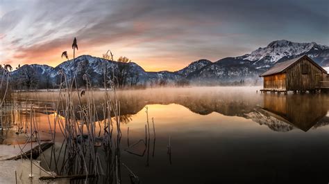 Download 2560x1440 Lake Reflection Scenery Mountains Sunset