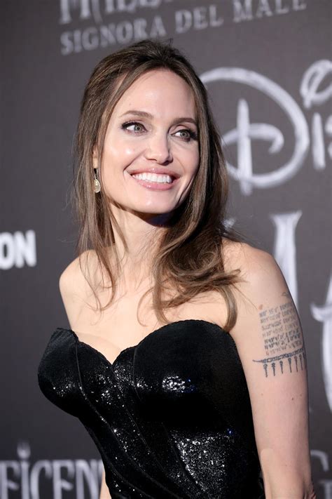 Angelina Jolie Bewitching In Black Corset At Maleficent Premiere