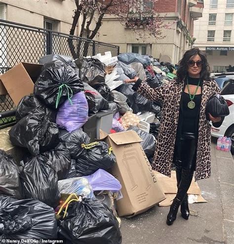 Nancy Dellolio Cuts A Chic Figure She Poses Next To Rubbish In Paris