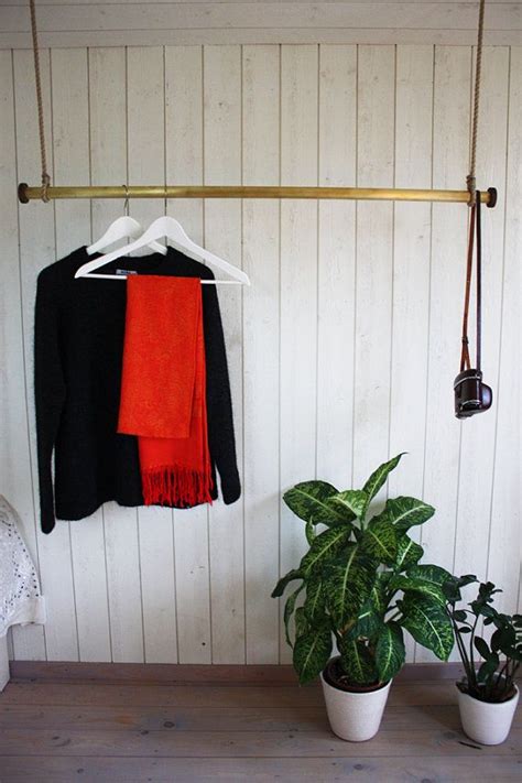 You can place these portable floating clothing racks at any place in your rooms. Floating clothing rack in brass/stainless steel by ...