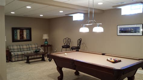 We install tables on all types of flooring. Finished basement with pool table. Glass block windows ...