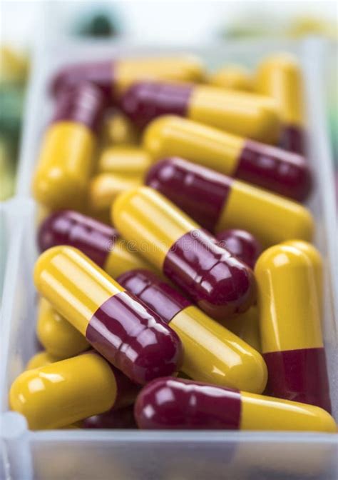 Capsules Of Red And Yellow Stock Photo Image Of Capsules 131090516