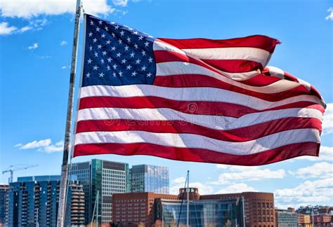 Boston Waterfront And Skyline And United States National Flag Ma Stock