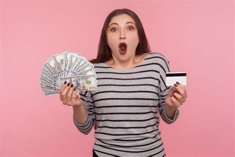 wow bank loan for shopping portrait of surprised hipster woman with fancy red hair holding