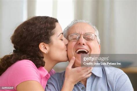 Old Man Kissing Young Woman Photos And Premium High Res Pictures