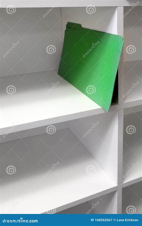 Green File Folder On Shelf For Business Organization Getting Started