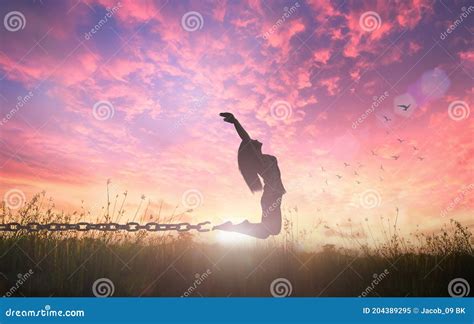 Freedom Concept Of Woman Jumping And Broken Chains Royalty Free Stock
