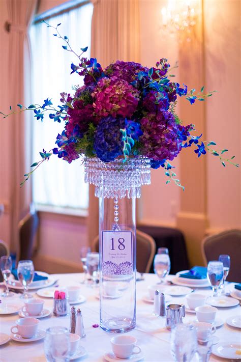 Maybe you would like to learn more about one of these? The centerpieces featured blue and purple hydrangea ...