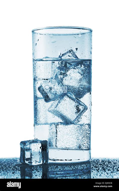 Glass Of Cold Water With Droplets And Ice Isolated On White Background