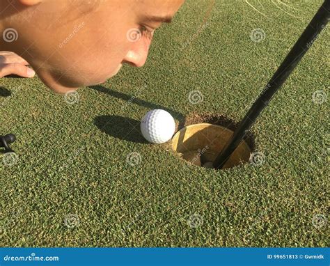 Golf Ball On Edge Of Hole Stock Image Image Of Ball 99651813