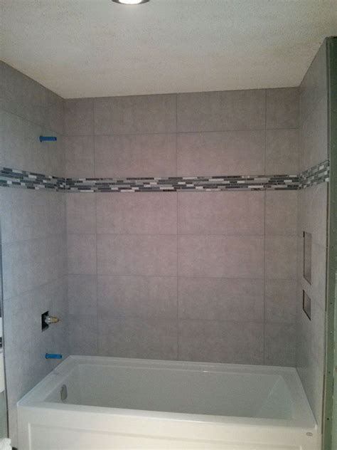 In this video we demonstrate a bathroom floor tiling and. Image result for 12x24 stacked tile in tub | Bathroom ...