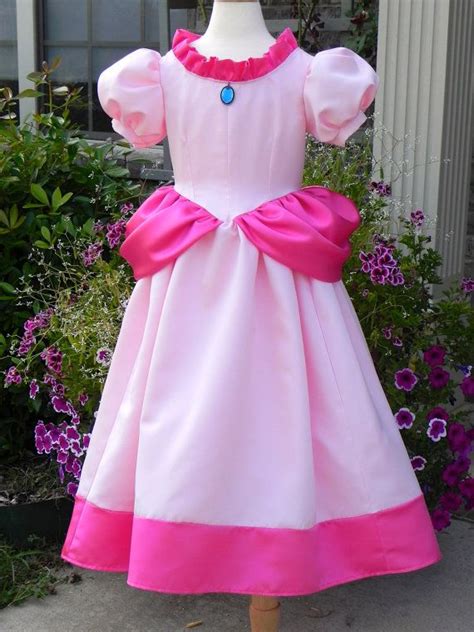 I will be cosplaying princess peach soon and started by making the crown first! Princess Peach Costume ball gown from Super Mario Brothers. Toddler to size 8. on Etsy, $245.00 ...