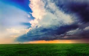 Storm Dark Clouds Flying Over Field With Green Grass Wallpaper By